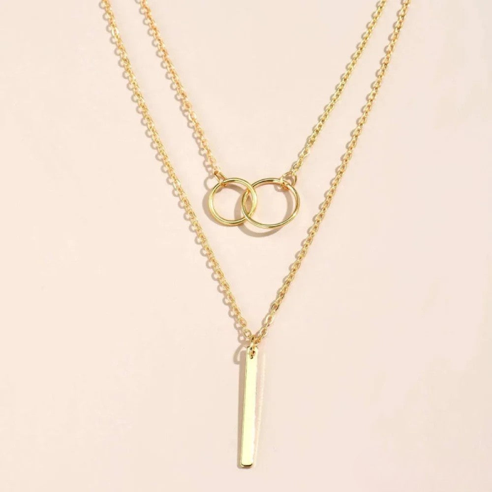 Collar retro dorado con colgante de doble aro